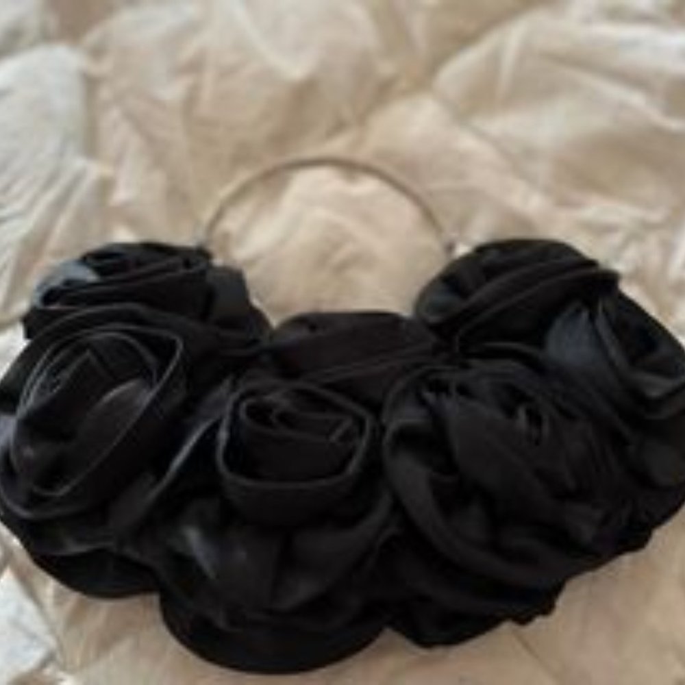Small black puffy flowered purse